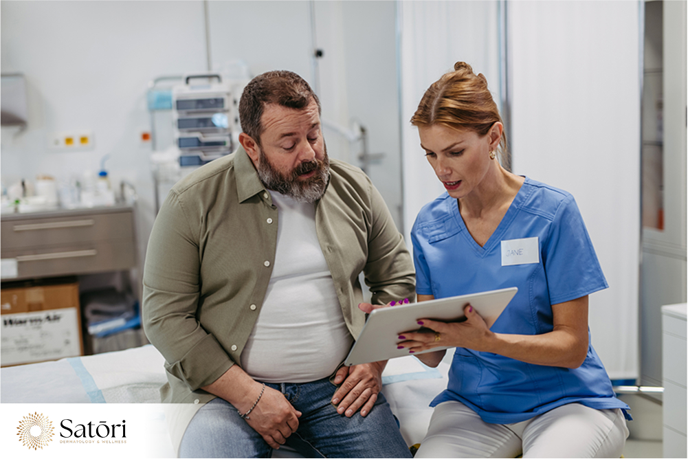 Overweight man consulting doctor about erectile dysfunction