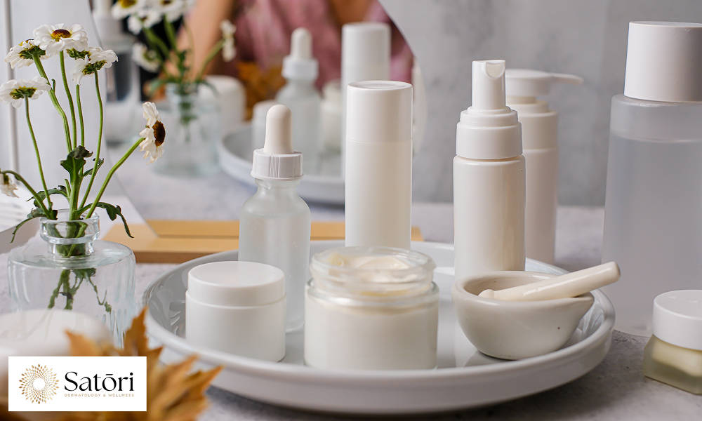 Skincare products for women in their 30s arranged neatly on a vanity tray.