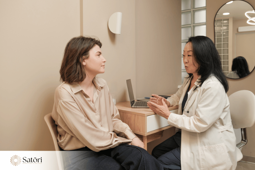 Woman discussing treatment options with stem cell dermatologist
